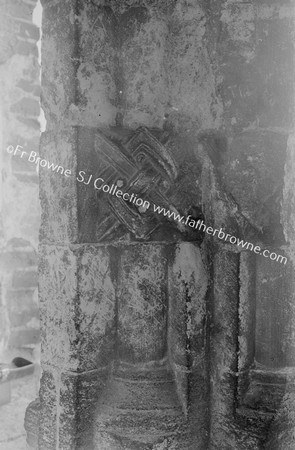 CASTLE RISING SAXON CARVINGS ON PILLAR OF WINDOW IN N. PASSAGE W. SIDE